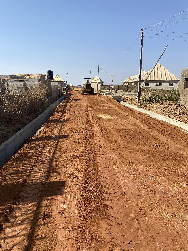 Road earthworks and grading with heavy equipment in Katampe Ext. Abuja